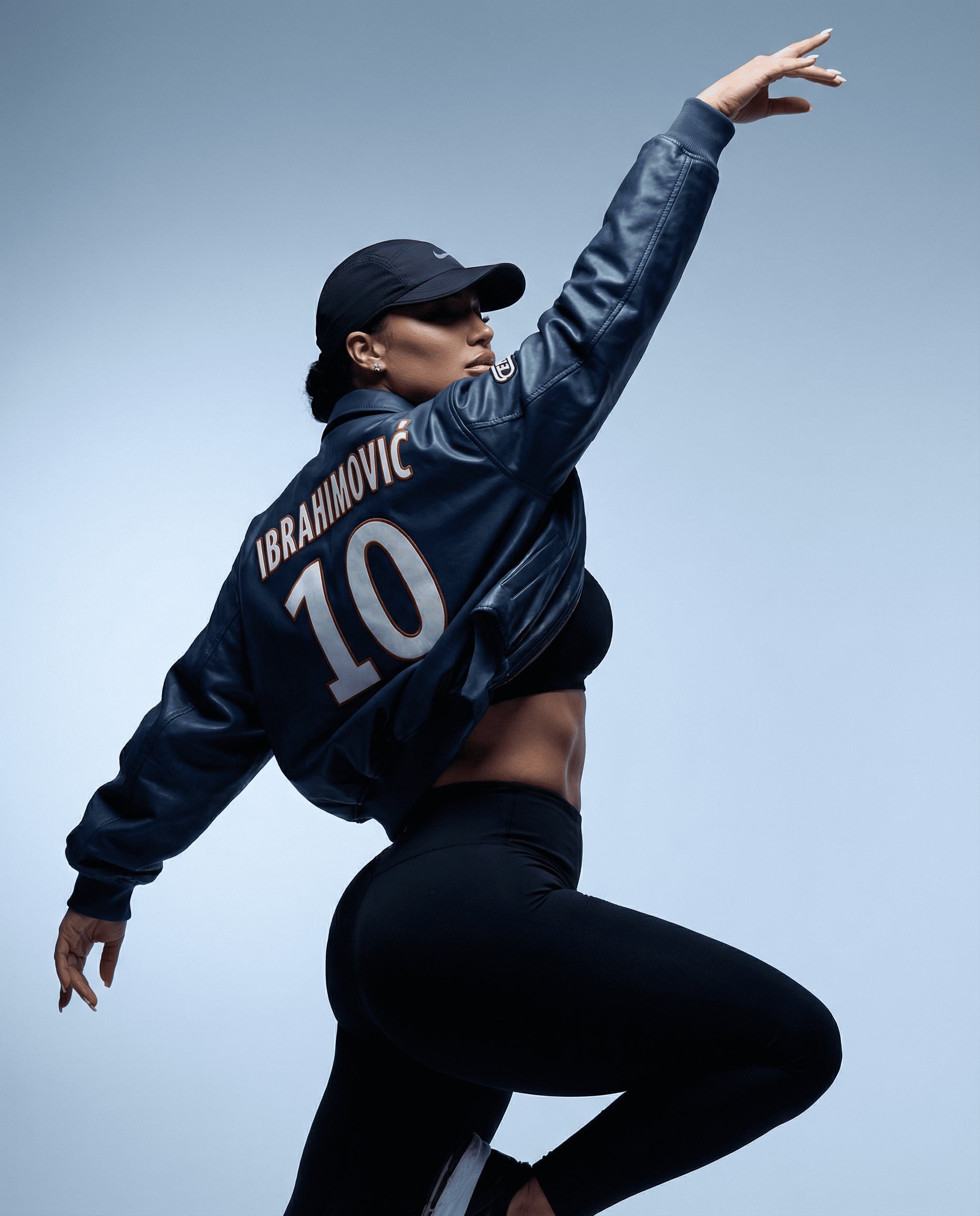 Person wearing a sports jacket with 'Ibrahimovic' and number '10' on a gray background